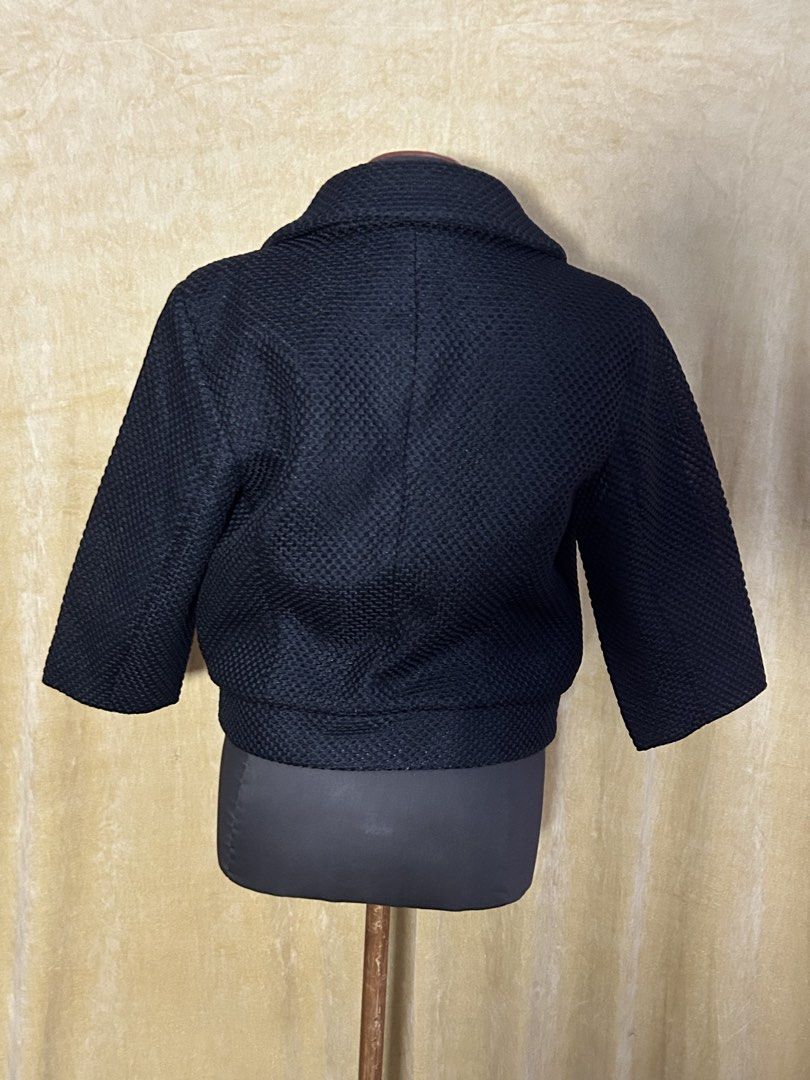Black Textured Cropped Jacket with Collar (Category: Coats, Jackets and Outerwear) located in Batangas. Submitted by mkjgb (Listing ID 1449410879, Image 3). Description: Bought in Palm Springs, CA. Length from shoulder is 19”. Width at waist is 16.5” (laid flat). - Black textured cropped jacket - Features a collar - Three-quarter sleeves - Single button closure - Ideal for layering or wearing solo - Versatile piece ❄️ Travel-Ready Winter Wear | S