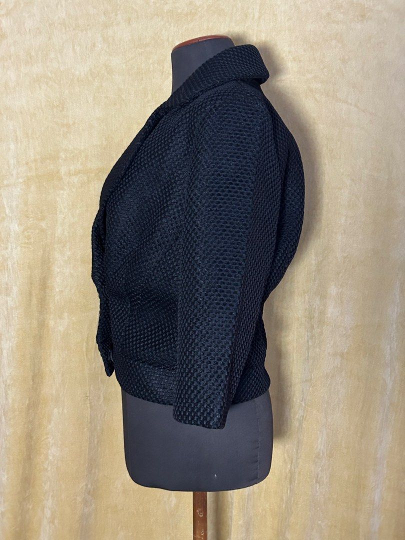 Black Textured Cropped Jacket with Collar (Category: Coats, Jackets and Outerwear) located in Batangas. Submitted by mkjgb (Listing ID 1449410879, Image 2). Description: Bought in Palm Springs, CA. Length from shoulder is 19”. Width at waist is 16.5” (laid flat). - Black textured cropped jacket - Features a collar - Three-quarter sleeves - Single button closure - Ideal for layering or wearing solo - Versatile piece ❄️ Travel-Ready Winter Wear | S