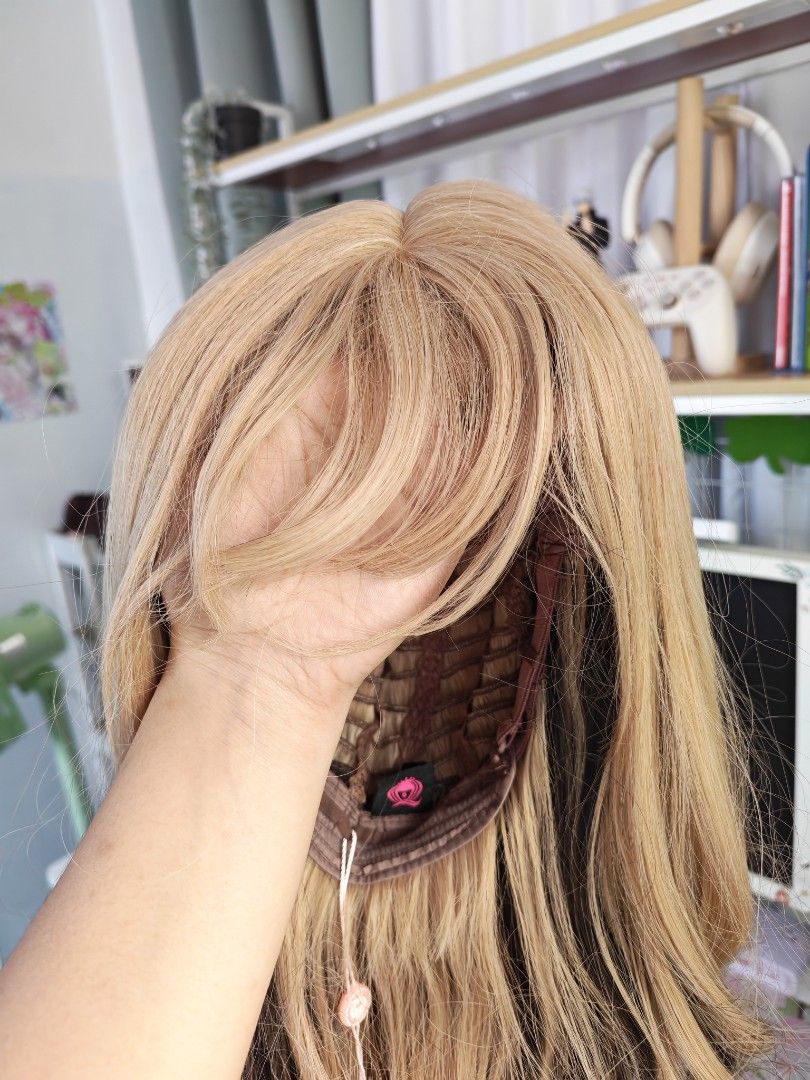 Blonde wavy Wig with black highlights (Category: Hair) located in Quezon City. Submitted by mikhcruz (Listing ID 1449533466, Image 3). Description: Never been used outside, for indoor photos only - Cream, black, and brown wavy wig - 62cm length - Features bangs - Brand: Seven Queen - Matches photos exactly - Ideal for styling and cosplay RFS: di nagagamit .