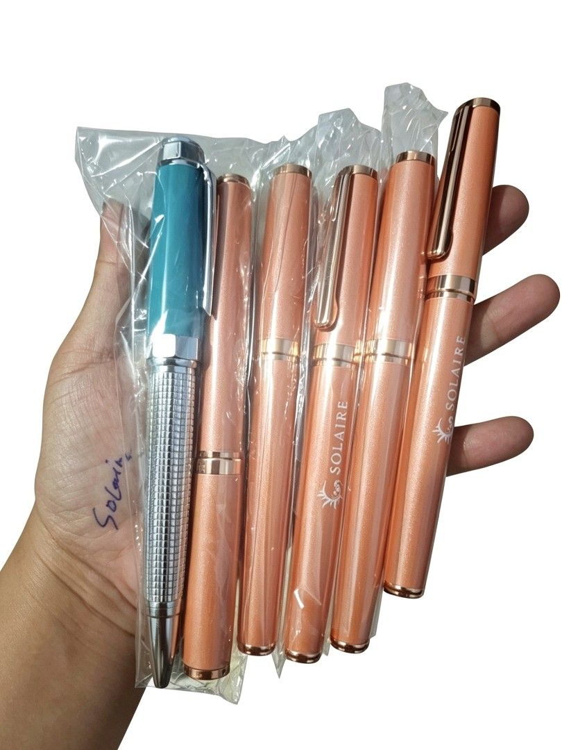 Blue Solaire Pens - sold each (Category: Stationery & School Supplies) located in Quezon City. Submitted by ana-chan (Listing ID 1449343061, Image 1). Description: Set of 6 Solaire pens: 1 teal/silver, 5 rose gold (shimmering). All new in original packaging. Perfect for gifts!.