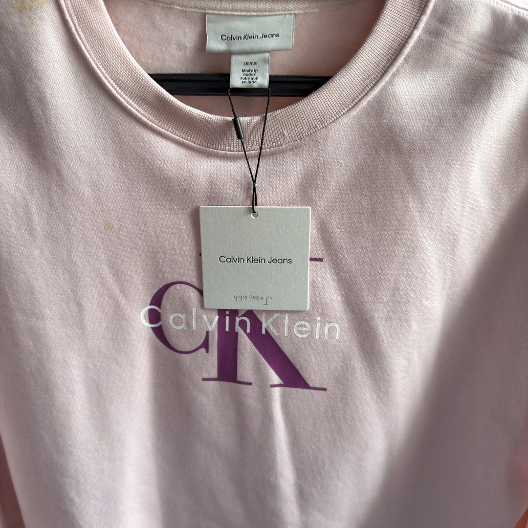 Brand New Calvin Klein Sweater (Category: Coats, Jackets and Outerwear) located in Angeles City. Submitted by joshlp (Listing ID 1449331726, Image 3). Description: Brand new from US Baggy fit Pastel pink Please expect minor stains, as this item has been in storage. If you would like it to be washed before shipping, please allow an additional 3–5 days for processing prior to dispatch..