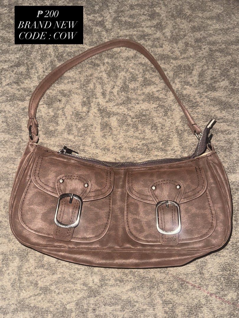 Brown Buckle Bag (Category: Shoulder Bags) located in Batangas. Submitted by chaeeyi (Listing ID 1449357305, Image 1). Description: BRAND NEW MOP : GCASH (PAYMENT FIRST ONLY) MOD : JNT.