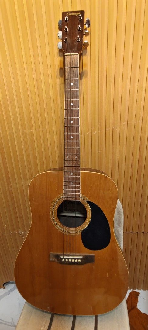 Cadenza Acoustic Guitar (Category: Musical Instruments) located in Bulacan. Submitted by babz30261 (Listing ID 1449429396, Image 3). Description: - Cadenza acoustic guitar - Natural wood finish - Dot inlays on fretboard - Silver-colored tuning pegs - Ideal for beginners and casual players - Ready for its new owner.