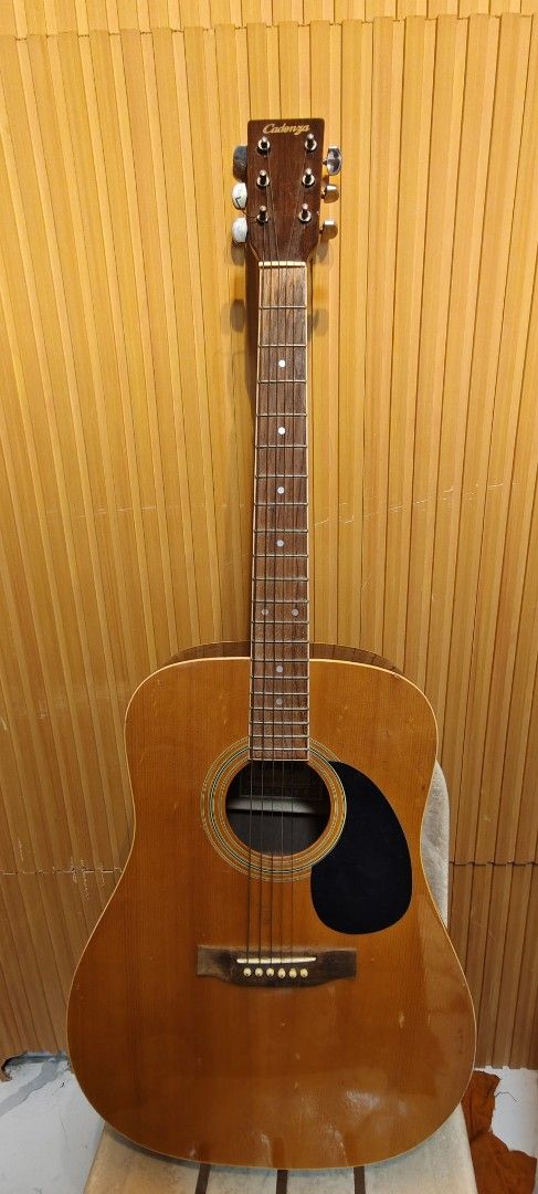 Cadenza Acoustic Guitar (Category: Musical Instruments) located in Bulacan. Submitted by babz30261 (Listing ID 1449429396, Image 1). Description: - Cadenza acoustic guitar - Natural wood finish - Dot inlays on fretboard - Silver-colored tuning pegs - Ideal for beginners and casual players - Ready for its new owner.