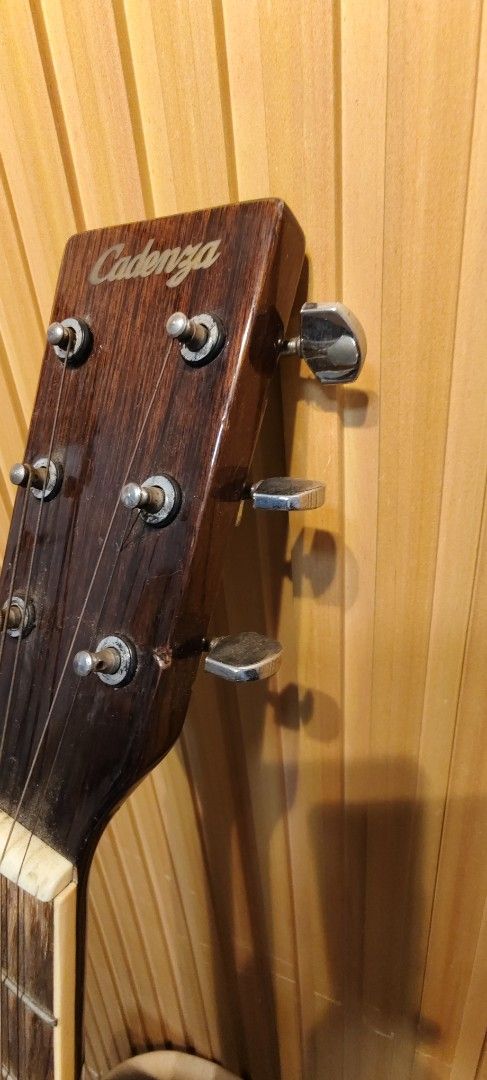 Cadenza Acoustic Guitar (Category: Musical Instruments) located in Bulacan. Submitted by babz30261 (Listing ID 1449429396, Image 2). Description: - Cadenza acoustic guitar - Natural wood finish - Dot inlays on fretboard - Silver-colored tuning pegs - Ideal for beginners and casual players - Ready for its new owner.