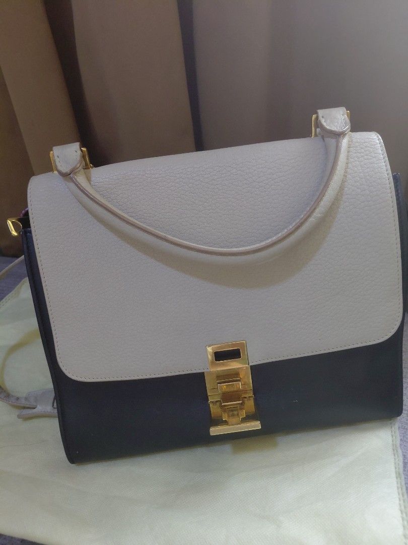Celine Trapeze (Category: Luxury Bags & Wallets) located in Pasig City. Submitted by redellie (Listing ID 1449414531, Image 2). Description: Brand/Model: Celine Trapeze. Colorway: Tricolor (Beige/Gray, Black, and potentially Red or Burnt Orange sides). Material: Smooth calfskin leather. Features: Iconic top handle, expanding accordion wings, and a clasp closure. Inclusion: strap only and auth card.