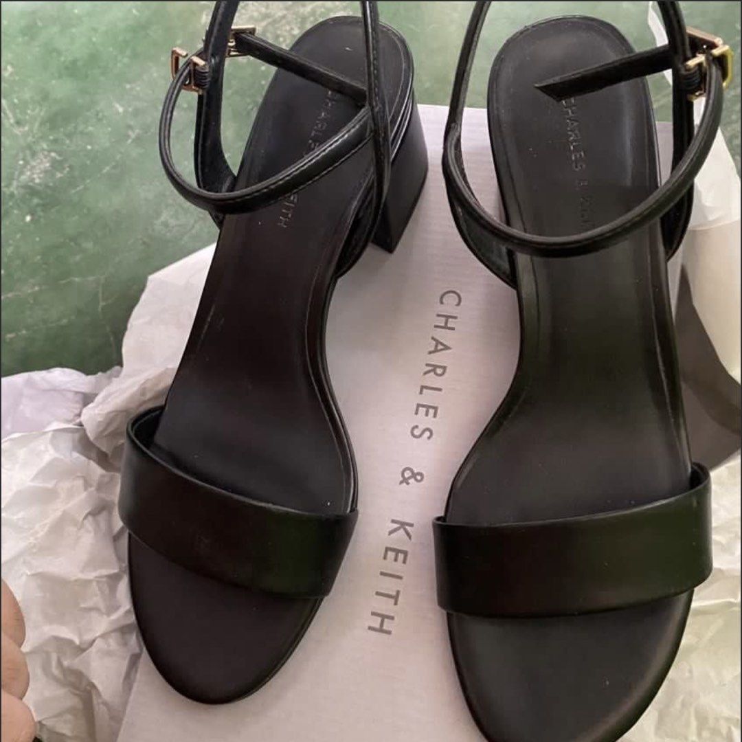 Charles & Keith Black Block Heel Ankle Strap Sandals (Category: Heels) located in Rizal. Submitted by melowfashion_preloved (Listing ID 1449501811, Image 1). Description: PLEASE READ 👇 ❌No to BOGUS buyer ✅ Item is AVAILABLE 📍Rizal, shipping via Lalamove or Grab - Brand: Charles & Keith - Color: Black -Size: US6, 23cm - Style: Block heel sandals - Features: Ankle strap with buckle closure, single wide strap across toes - Includes: Original box a