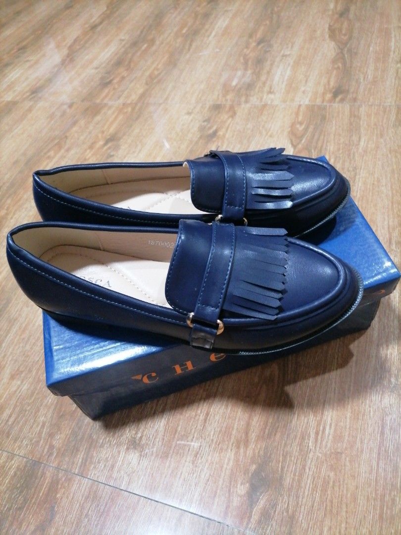CHESCA Navy Blue Tassel Loafers (Category: Loafers) located in Caloocan City. Submitted by weiner_ (Listing ID 1449407361, Image 2). Description: - Brand: CHESCA - Color: Navy Blue - Style: Loafers - Features: Tassel detail, gold buckle accent - Closure: Classic slip-on - Includes: Original box - Size 37.