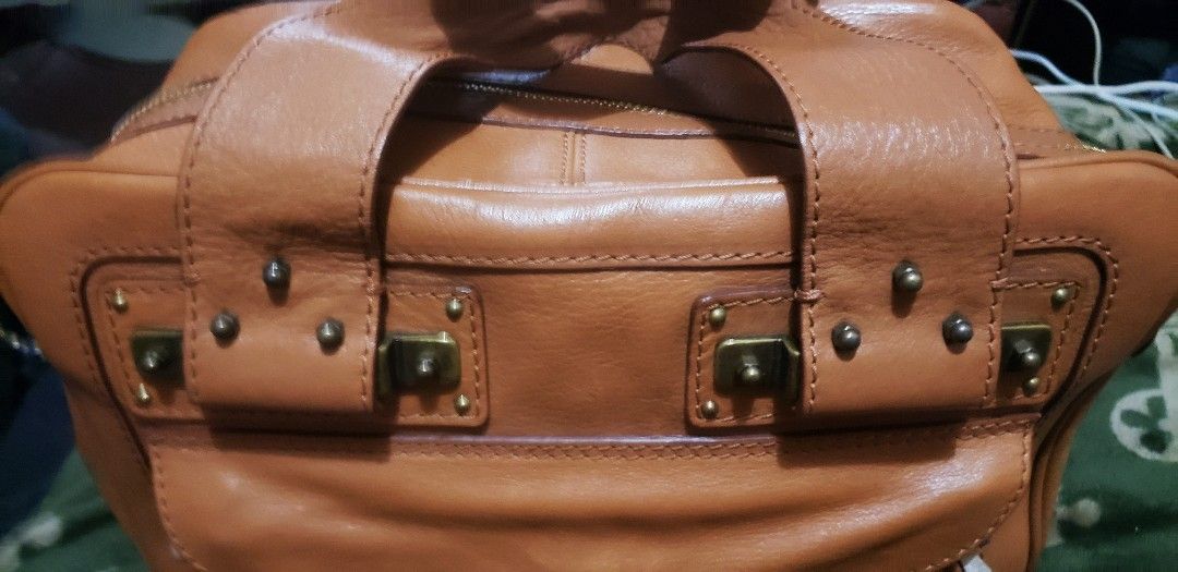 Chloe Leather Handbag (Category: Luxury Bags & Wallets) located in Marikina City. Submitted by racoon143 (Listing ID 1449434209, Image 3). Description: - Authentic brown leather Chloe handbag - Signature Chloe hardware and flap pocket - Convenient top handles - Secure zipper closure - Spacious interior, ideal for everyday essentials - Shows some signs of wear, but remains in good overall condition.