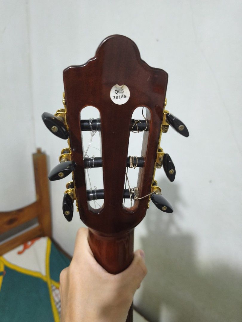 Classical Guitar Severo CG-1T (Category: Musical Instruments) located in Los Banos. Submitted by jensenroiperez (Listing ID 1449482948, Image 3). Description: - Negotiable - Severo CG-1T Classical Guitar - Gloss Finish 41" - Gold Plated Tuners - With bag - With truss rod - Need pa ipasetup siguro konti para mag improve playing kase never pa napasetup since binili - Orig price is 7,800 - Equipped with D'addario Strings.