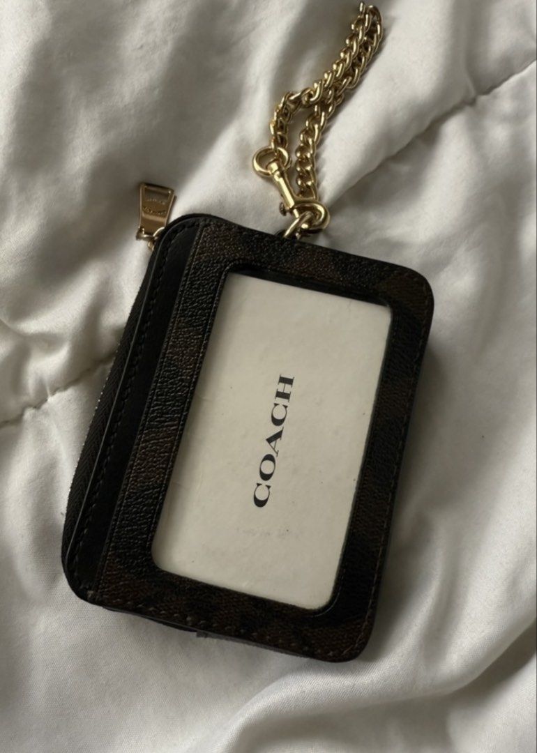 Coach Wallet (Category: Luxury Bags & Wallets) located in Batangas. Submitted by gaprelovedthings (Listing ID 1449434398, Image 3). Description: - Authentic Coach cardholder - Signature C print in brown and black - Zippered compartment for coins or folded bills - Multiple card slots on the front - Detachable gold chain strap - Ideal for organizing essentials like cards and cash.