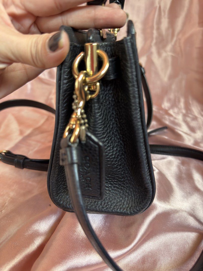 Coach Signature Canvas Top Handle Bag (Category: Luxury Bags & Wallets) located in Manila. Submitted by olxph_ (Listing ID 1449367088, Image 3). Description: Original coach mini lane top handle Like new Pm me .