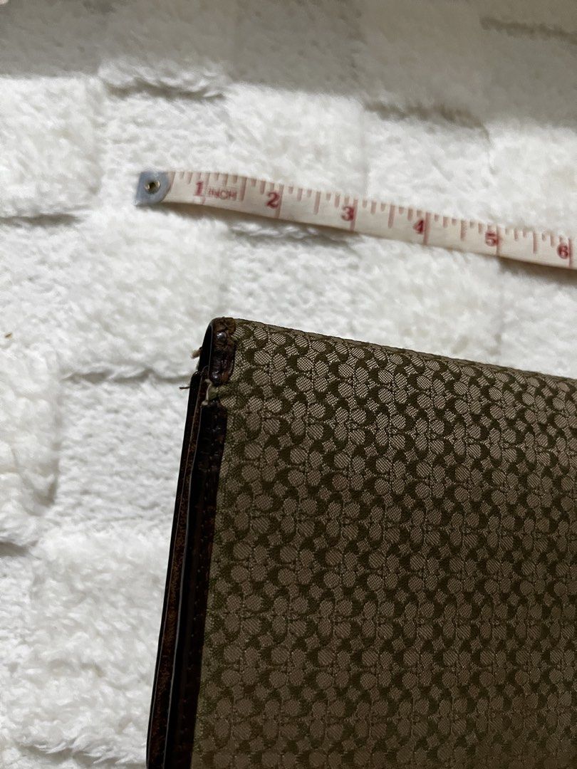 Coach Signature Pattern Leather Trifold Wallet Brown (Category: Luxury Bags & Wallets) located in Manila. Submitted by shopthevintage (Listing ID 1449463554, Image 2). Description: - Authentic Brown Coach Trifold Wallet - Signature Coach 'C' Pattern Exterior - Genuine Leather Interior - Multiple Card Slots for Organization - Convenient Zippered Pocket - Classic and Spacious Design.