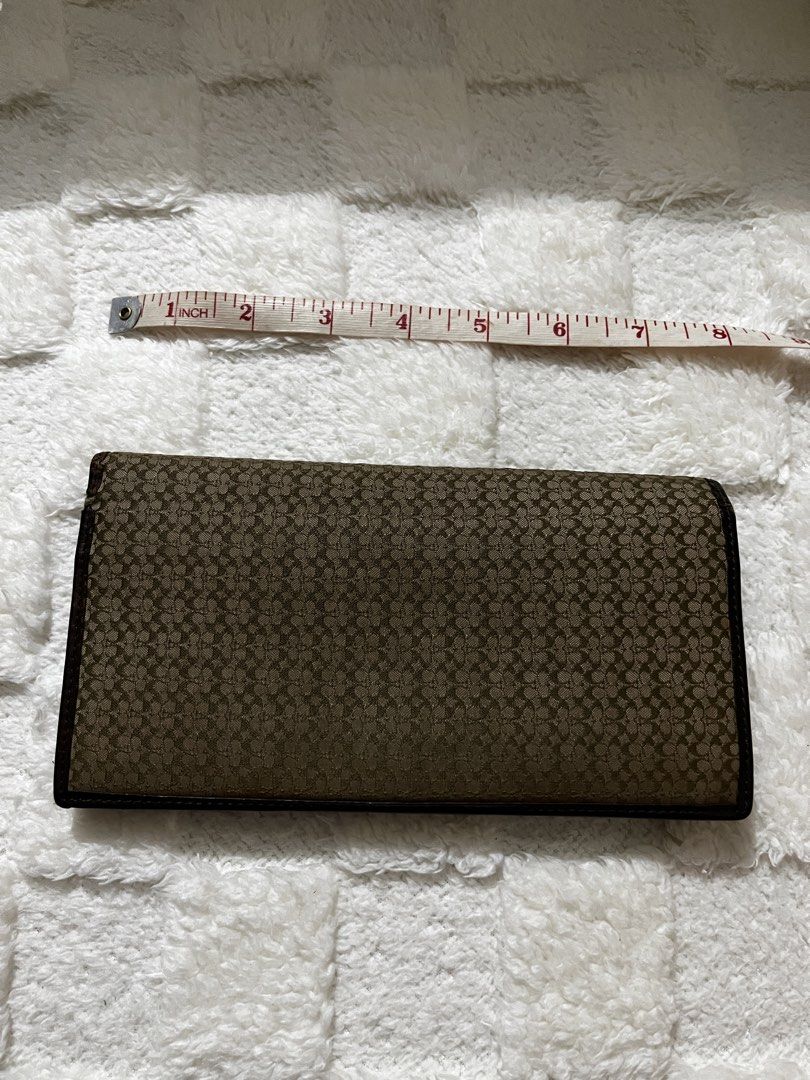 Coach Signature Pattern Leather Trifold Wallet Brown (Category: Luxury Bags & Wallets) located in Manila. Submitted by shopthevintage (Listing ID 1449463554, Image 1). Description: - Authentic Brown Coach Trifold Wallet - Signature Coach 'C' Pattern Exterior - Genuine Leather Interior - Multiple Card Slots for Organization - Convenient Zippered Pocket - Classic and Spacious Design.