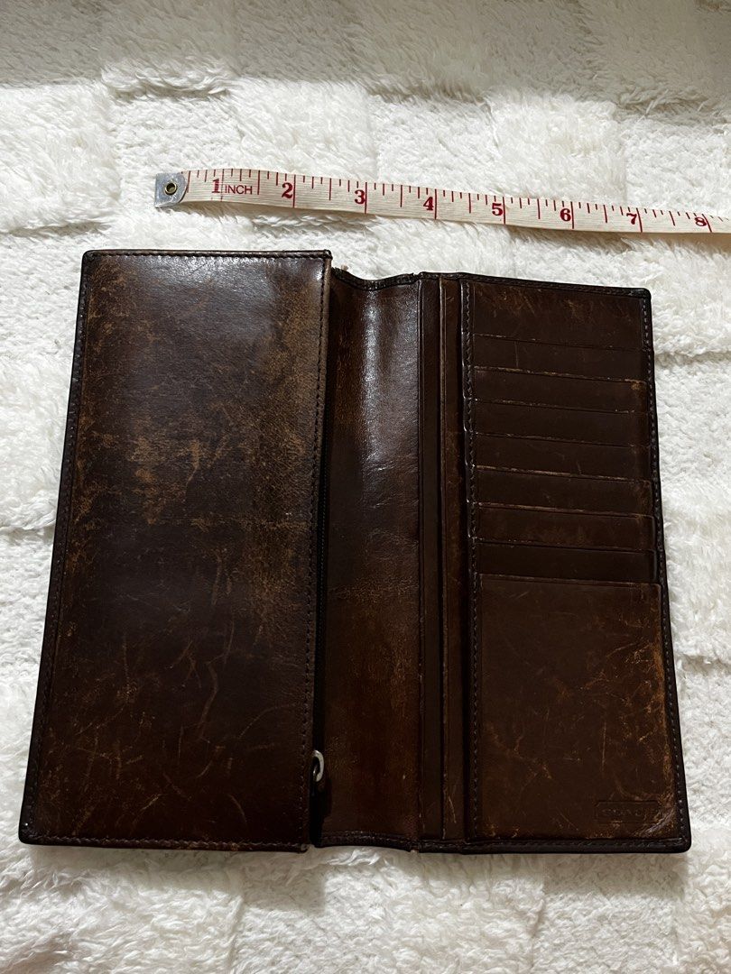 Coach Signature Pattern Leather Trifold Wallet Brown (Category: Luxury Bags & Wallets) located in Manila. Submitted by shopthevintage (Listing ID 1449463554, Image 3). Description: - Authentic Brown Coach Trifold Wallet - Signature Coach 'C' Pattern Exterior - Genuine Leather Interior - Multiple Card Slots for Organization - Convenient Zippered Pocket - Classic and Spacious Design.