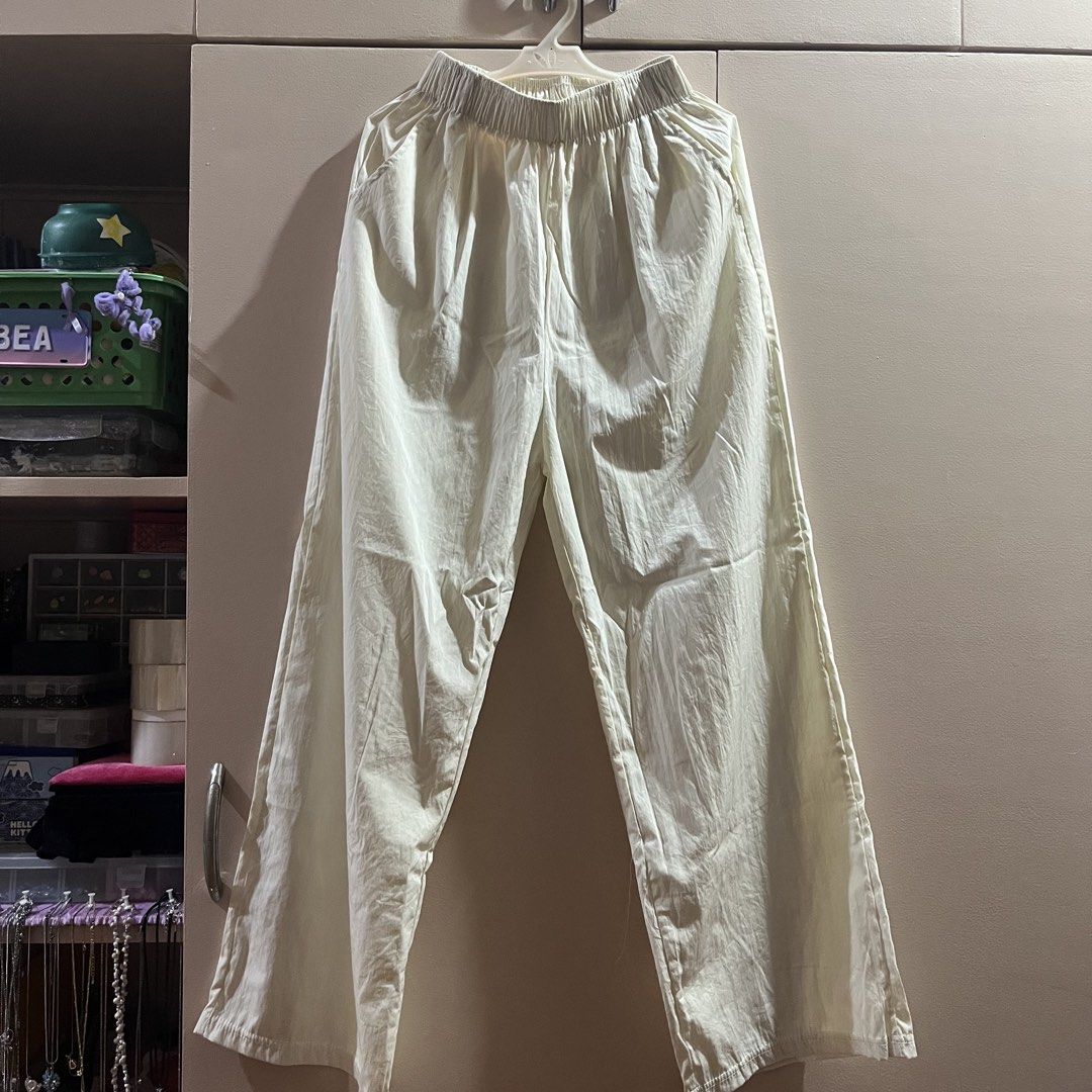 Cream High Waisted Baggy Pants (Category: Other Bottoms) located in Pasig City. Submitted by beabimbop (Listing ID 1449342864, Image 3). Description: • 24-26” waist • No issues, but note na medyo sheer yung fabric so need to wear white/cream shorts inside • Comfy, stretchy • RFS: Di nagagamit tags: baggy pants, work pants, square pants, wide legged pants, high waisted pants.