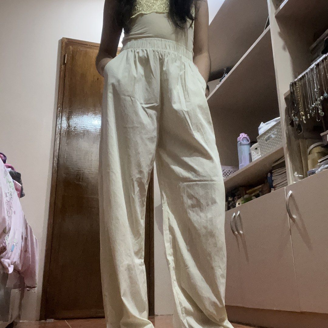 Cream High Waisted Baggy Pants (Category: Other Bottoms) located in Pasig City. Submitted by beabimbop (Listing ID 1449342864, Image 2). Description: • 24-26” waist • No issues, but note na medyo sheer yung fabric so need to wear white/cream shorts inside • Comfy, stretchy • RFS: Di nagagamit tags: baggy pants, work pants, square pants, wide legged pants, high waisted pants.