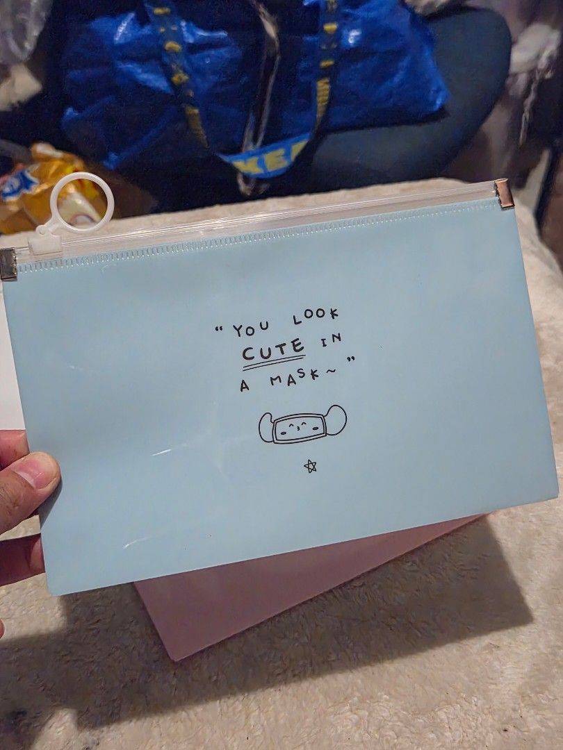 Cute Mask Design Zipper Pouch - Blue 2 pcs (Category: Purses & Pouches) located in Mandaue City. Submitted by chuchi152615 (Listing ID 1449512260, Image 1). Description: - Light blue zipper pouch - Features a cute mask drawing and 'YOU LOOK CUTE IN A MASK~' text - Zipper works well with a white ring pull - Ideal for storing small items (stationery, makeup, etc.) - Approximately 9 inches wide.