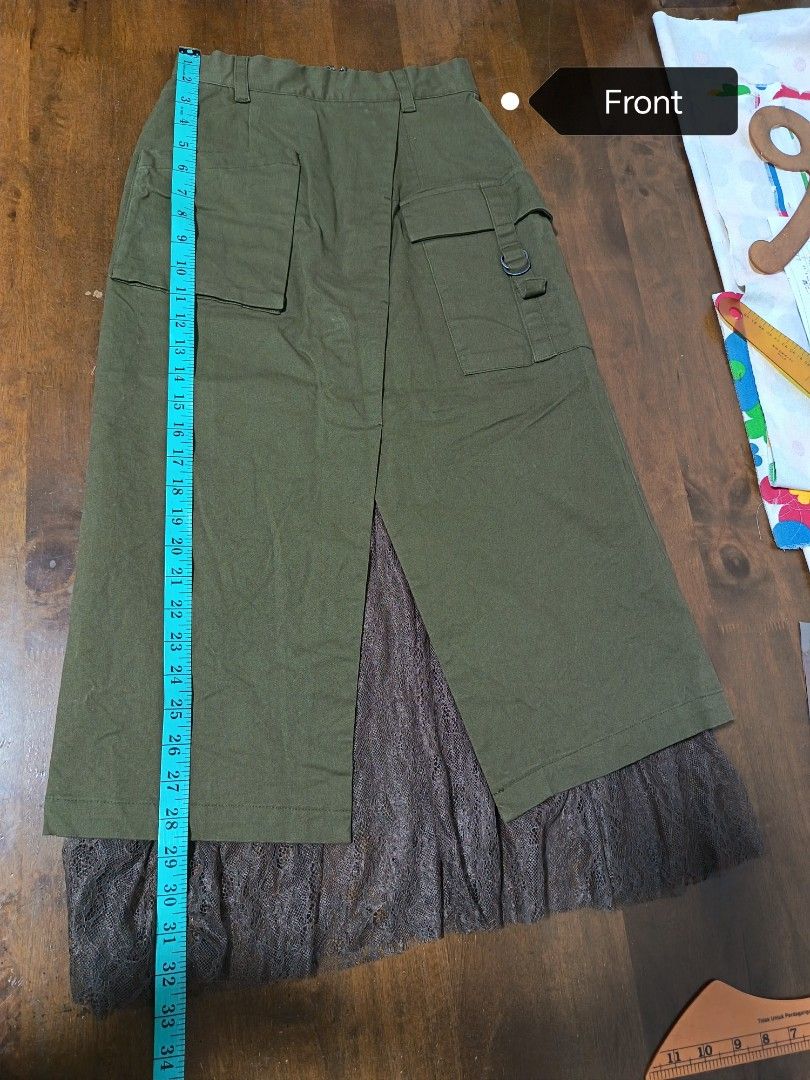 Dazzlin Cargo Skirt with Lace Underlay (Category: Skirts) located in Putrajaya. Submitted by deja_ff (Listing ID 1449506839, Image 3). Description: - Brand new olive green cargo midi skirt - Delicate lace underskirt - Stylish front slit - Functional front and back pockets - Comfortable elastic waistband at the back with zip closure - Midi length (approx. 30 inches) - Waist measurement (approx. 15 inches across) - Tags attached.