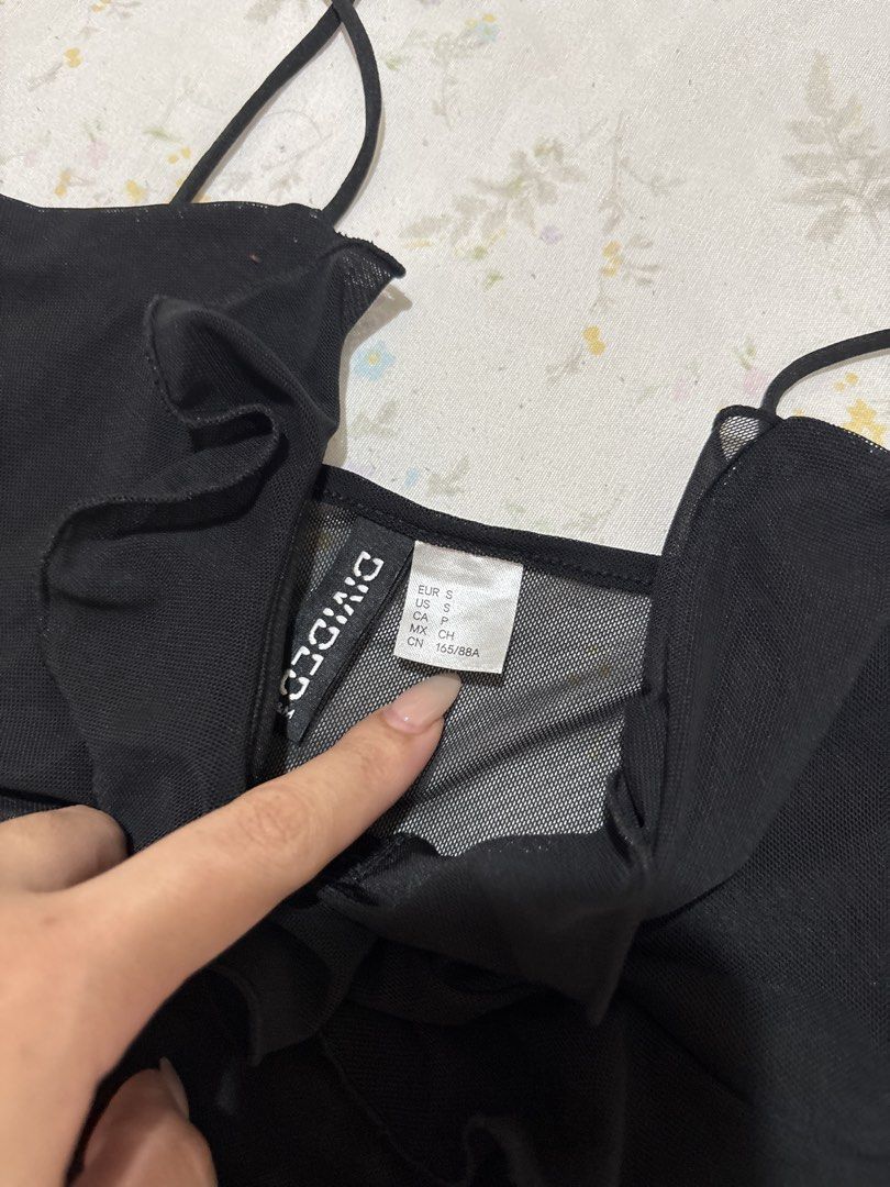 Divided H&M Black Mesh Ruffle Camisole Top (Category: Sleeveless) located in Marikina City. Submitted by koletteyy (Listing ID 1449387843, Image 3). Description: - worn once - S on tag but can fit ‘til semi L 40C bust (stretchy) - no flaws .