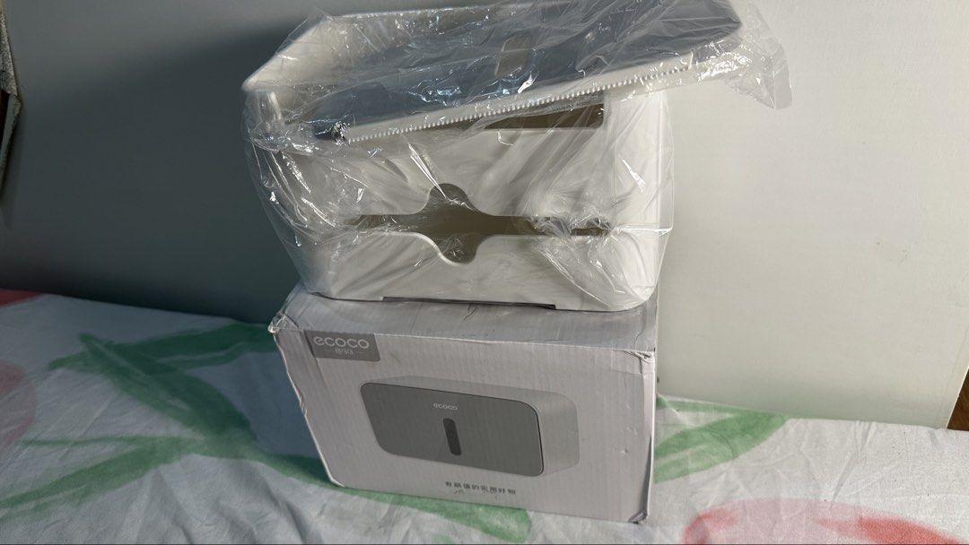 ECOCO Wall Mounted Tissue Box Holder Dispenser White (Category: Storage Boxes & Baskets) located in Naic. Submitted by cilissa (Listing ID 1449432274, Image 1). Description: - Stylish white and grey wall-mounted tissue box holder. - Brand new, in original packaging. - Simple and easy installation. - Keeps tissues neat and readily accessible. - Perfect for bathrooms and kitchens..