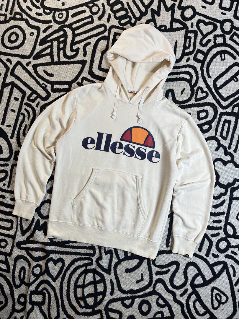 Ellesse Cream Hoodie with Logo (Category: Hoodies) located in Silang. Submitted by yusthrift (Listing ID 1449343655, Image 1). Description: - Cream coloured Ellesse hoodie - Classic Ellesse logo on the front - Convenient kangaroo pocket - Adjustable drawstring hood - Size S on tag (M-L women) - Ideal for everyday casual wear 21 inches width 25.5 inches length No issue Very good condition Need wash.