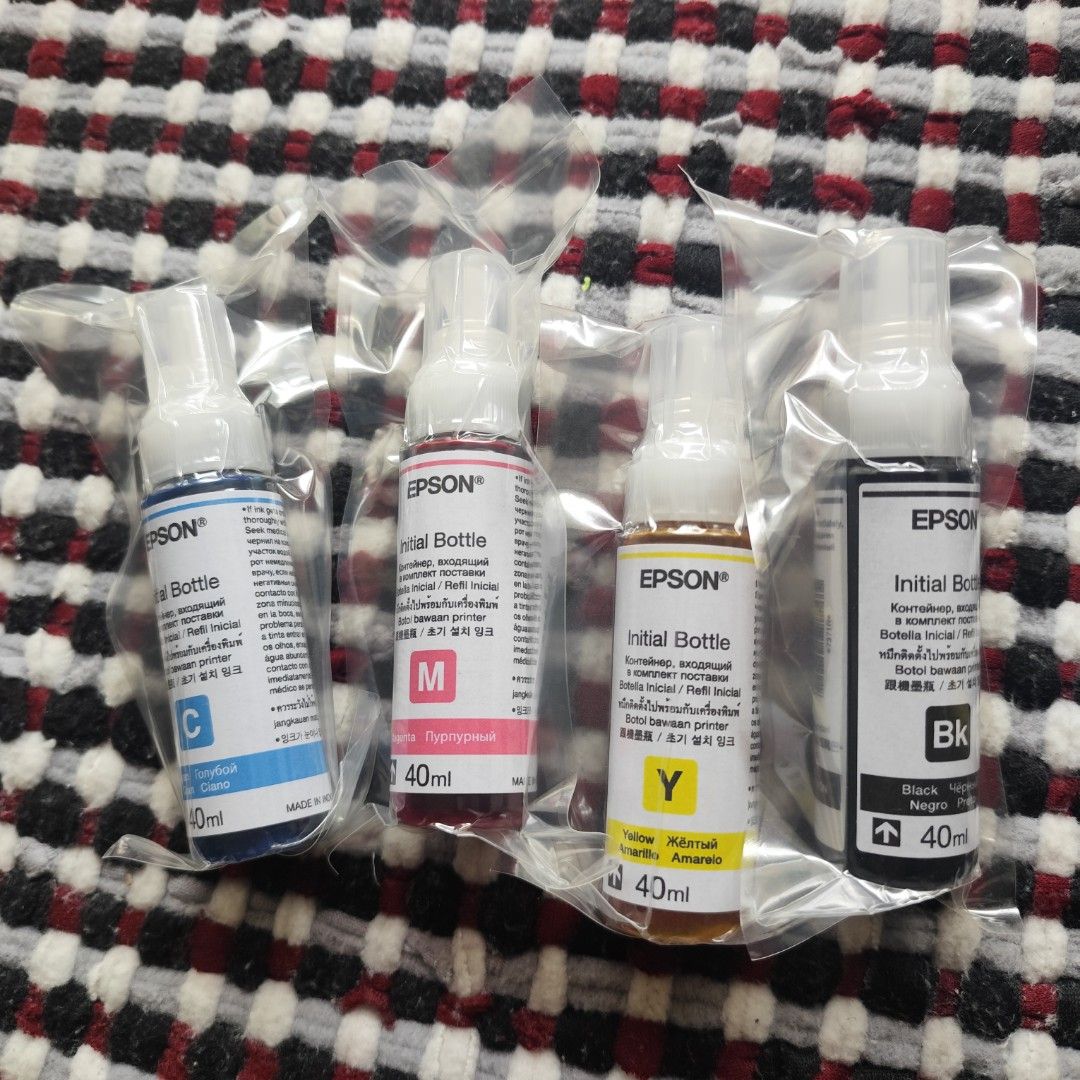 Epson 664 (T664) Genuine Initial Dye Ink Bottles (Category: Printers, Scanners & Copiers) located in Imus. Submitted by candelars (Listing ID 1449454270, Image 2). Description: - Set of 4 Epson initial ink bottles - Includes Cyan, Magenta, Yellow, and Black - 40ml per bottle - Brand new, unopened, and sealed - Compatible with Epson printers.