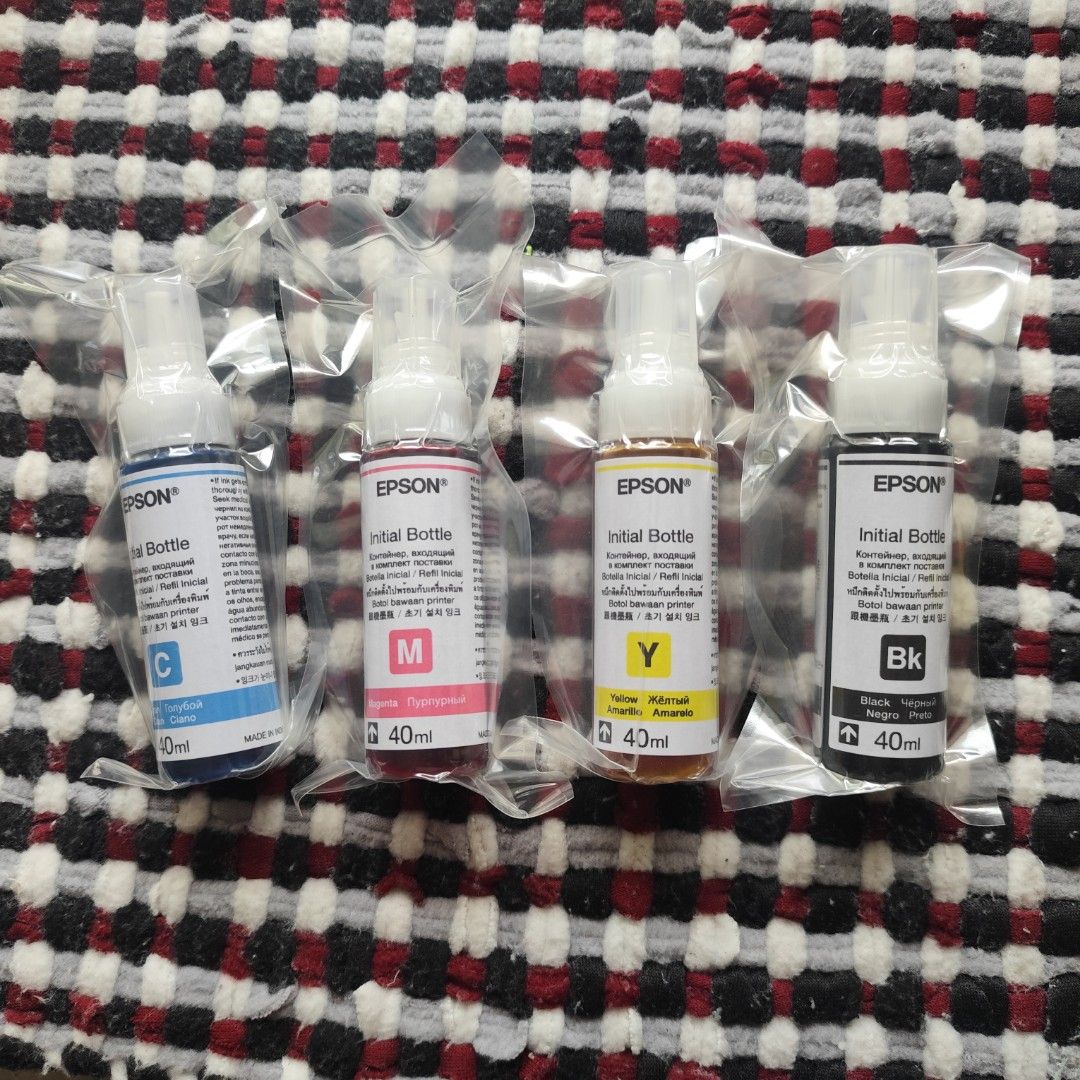 Epson 664 (T664) Genuine Initial Dye Ink Bottles (Category: Printers, Scanners & Copiers) located in Imus. Submitted by candelars (Listing ID 1449454270, Image 1). Description: - Set of 4 Epson initial ink bottles - Includes Cyan, Magenta, Yellow, and Black - 40ml per bottle - Brand new, unopened, and sealed - Compatible with Epson printers.