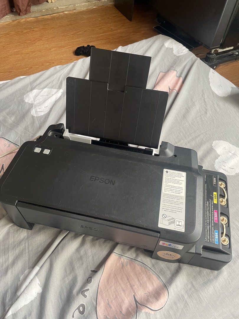 Epson Printer with Ink, Paper, and Crafting Tools (Category: Printers, Scanners & Copiers) located in Pasig City. Submitted by kiann. (Listing ID 1449392360, Image 1). Description: - Epson Printer with initial ink bottles - Additional pigment ink included - Copier paper - Photo sticker paper (glossy and matte) - Crafting tools: paper trimmer, stapler, hole punch, corner rounder - Ideal for home printing and DIY projects.