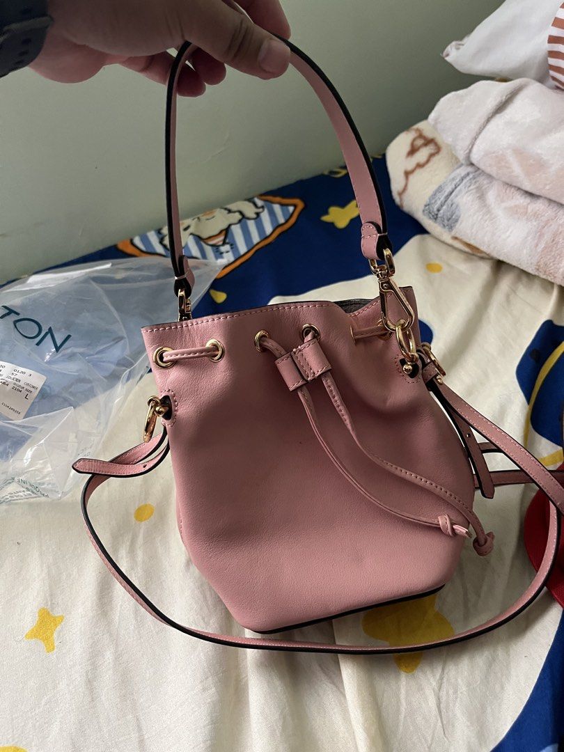 Fendi Pink Leather Mini Bucket Bag (Category: Luxury Bags & Wallets) located in Tabuk. Submitted by collectors_thrift_shop (Listing ID 1449377890, Image 1). Description: - Authentic Fendi mini bucket bag - Lovely pink genuine leather - Iconic Fendi logo charm - Secure drawstring closure - Versatile: top handle and detachable shoulder strap - Elegant gold hardware - Perfect for carrying your essentials.