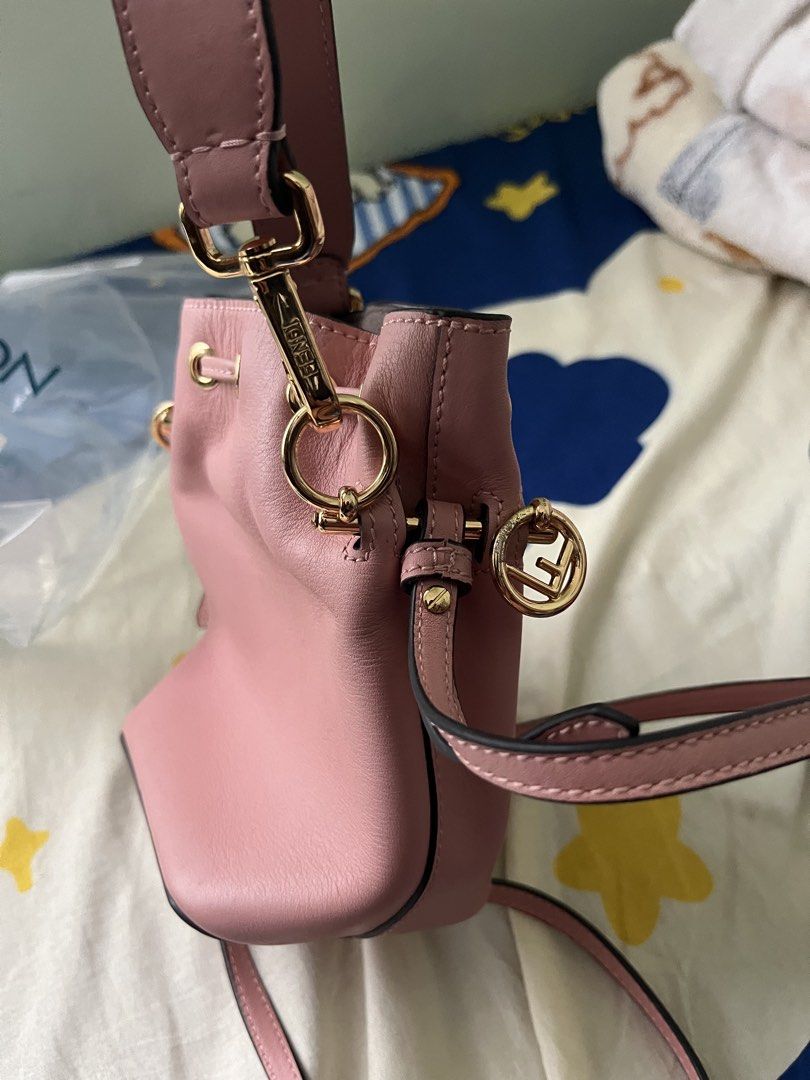 Fendi Pink Leather Mini Bucket Bag (Category: Luxury Bags & Wallets) located in Tabuk. Submitted by collectors_thrift_shop (Listing ID 1449377890, Image 3). Description: - Authentic Fendi mini bucket bag - Lovely pink genuine leather - Iconic Fendi logo charm - Secure drawstring closure - Versatile: top handle and detachable shoulder strap - Elegant gold hardware - Perfect for carrying your essentials.