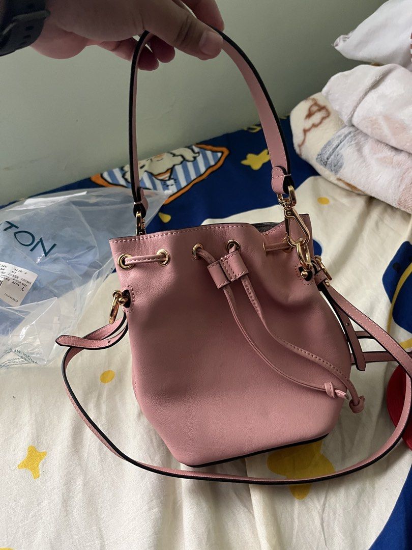 Fendi Pink Leather Mini Bucket Bag (Category: Luxury Bags & Wallets) located in Tabuk. Submitted by collectors_thrift_shop (Listing ID 1449377890, Image 2). Description: - Authentic Fendi mini bucket bag - Lovely pink genuine leather - Iconic Fendi logo charm - Secure drawstring closure - Versatile: top handle and detachable shoulder strap - Elegant gold hardware - Perfect for carrying your essentials.