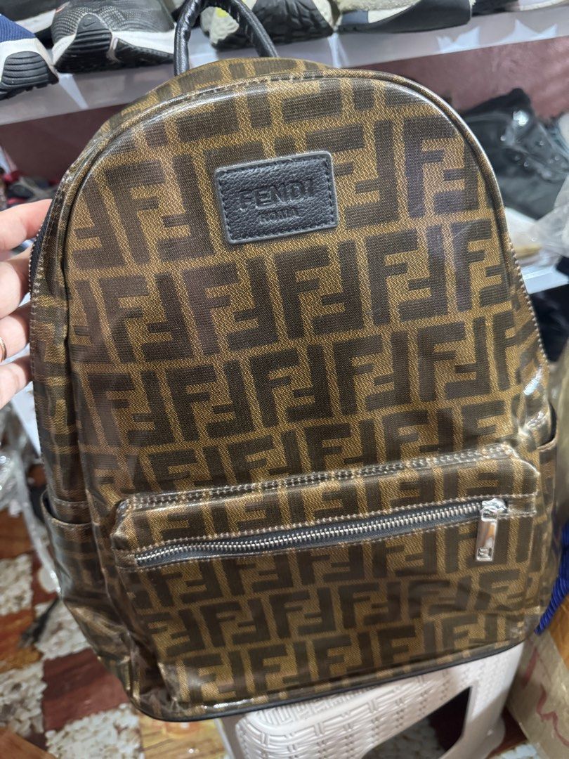 Fendi Roma FF Monogram Backpack (Category: Luxury Bags & Wallets) located in Manila. Submitted by wildbear.e10374 (Listing ID 1449344488, Image 1). Description: Classic Fendi backpack with the iconic FF monogram. Brown and black colorway. Has a front zipper pocket and main compartment. Interior has a zippered pocket and a sleeve pocket. Straps are adjustable. Great for everyday use..