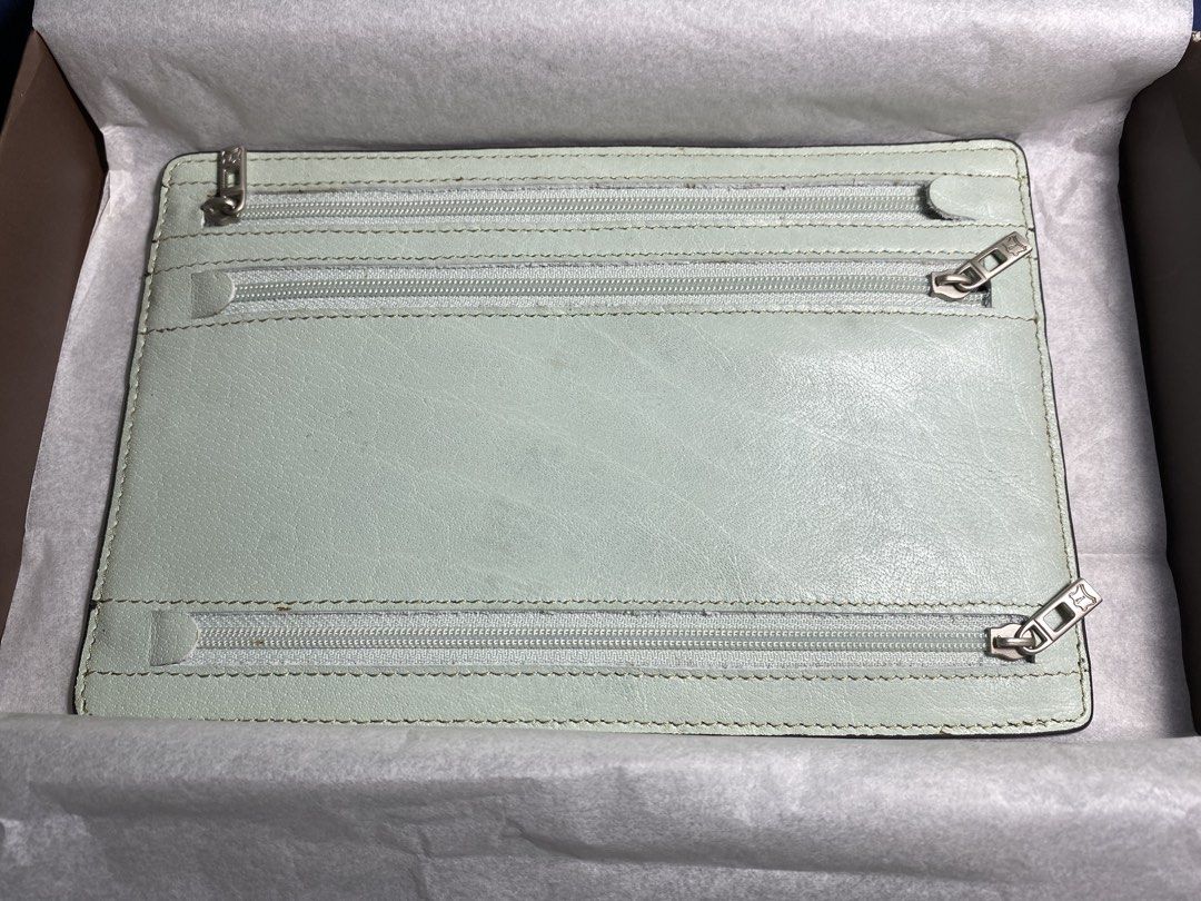 FINO LEATHERWARE Light Blue Leather Pouch with Zippers (Category: Purses & Pouches) located in Muntinlupa City. Submitted by mj.finds (Listing ID 1449436720, Image 2). Description: - Light blue FINO LEATHERWARE leather pouch - Main compartment for storage - Two zippered pockets on the back - Comes with original box and a thin cord - Ideal for organizing your essentials - Clean and well-maintained condition.