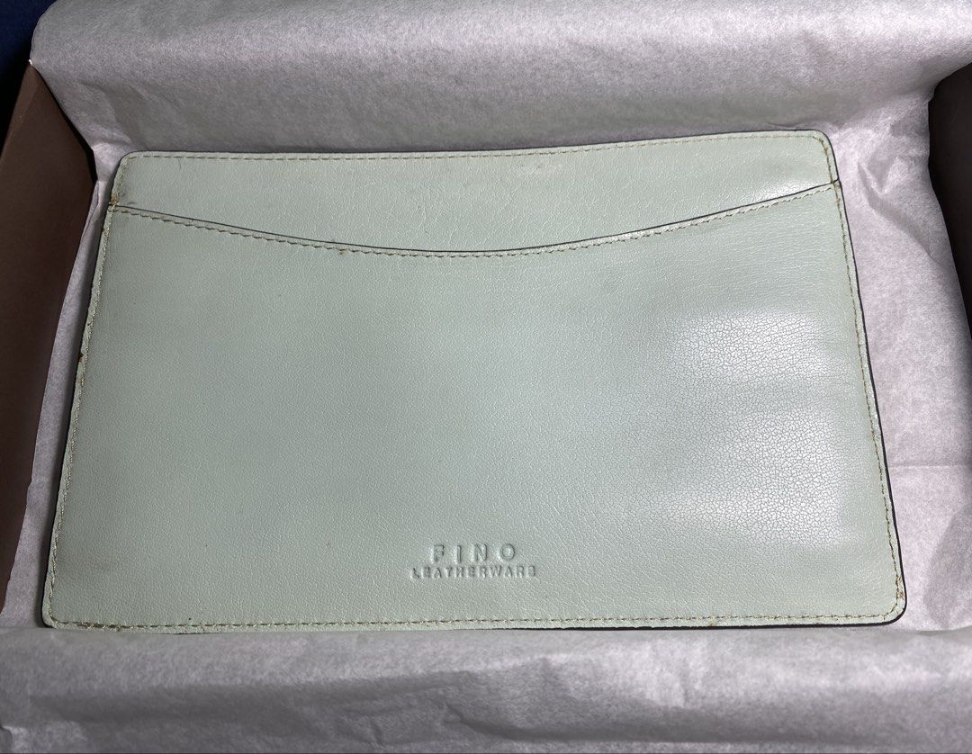 FINO LEATHERWARE Light Blue Leather Pouch with Zippers (Category: Purses & Pouches) located in Muntinlupa City. Submitted by mj.finds (Listing ID 1449436720, Image 1). Description: - Light blue FINO LEATHERWARE leather pouch - Main compartment for storage - Two zippered pockets on the back - Comes with original box and a thin cord - Ideal for organizing your essentials - Clean and well-maintained condition.
