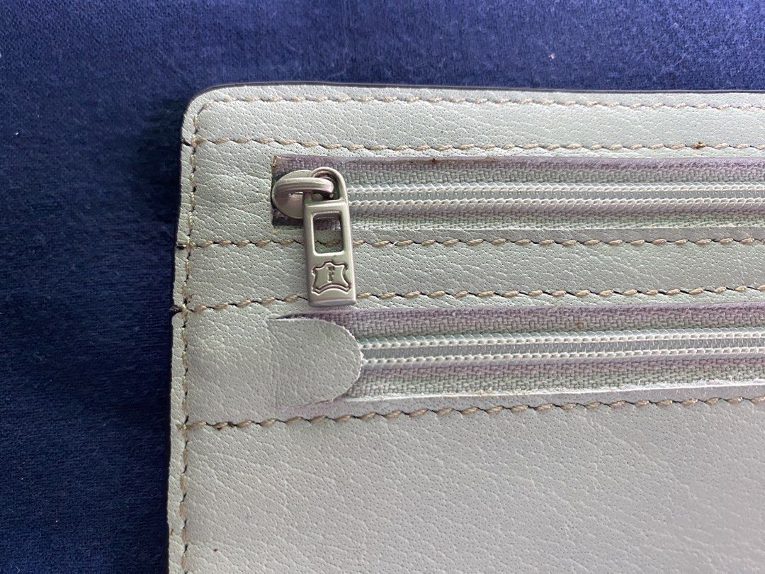 FINO LEATHERWARE Light Blue Leather Pouch with Zippers (Category: Purses & Pouches) located in Muntinlupa City. Submitted by mj.finds (Listing ID 1449436720, Image 3). Description: - Light blue FINO LEATHERWARE leather pouch - Main compartment for storage - Two zippered pockets on the back - Comes with original box and a thin cord - Ideal for organizing your essentials - Clean and well-maintained condition.