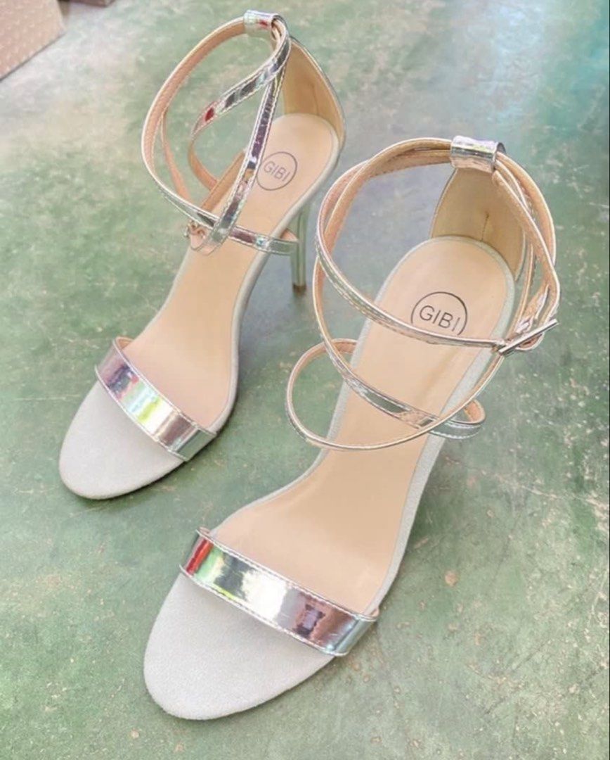 GIBI Silver Strappy Stiletto Heels Sandals (Category: Heels) located in Rizal. Submitted by melowfashion_preloved (Listing ID 1449502280, Image 2). Description: PLEASE READ 👇 ❌No to BOGUS buyer ✅ Item is AVAILABLE 📍Rizal, shipping via Lalamove or Grab - Brand: GIBI - Color: Silver -Size: 23cm, US 6 - Style: Strappy heels - Features: Delicate ankle strap, pointed toe, sleek stiletto heel - Condition: Comes with original box and tissue paper - Ap