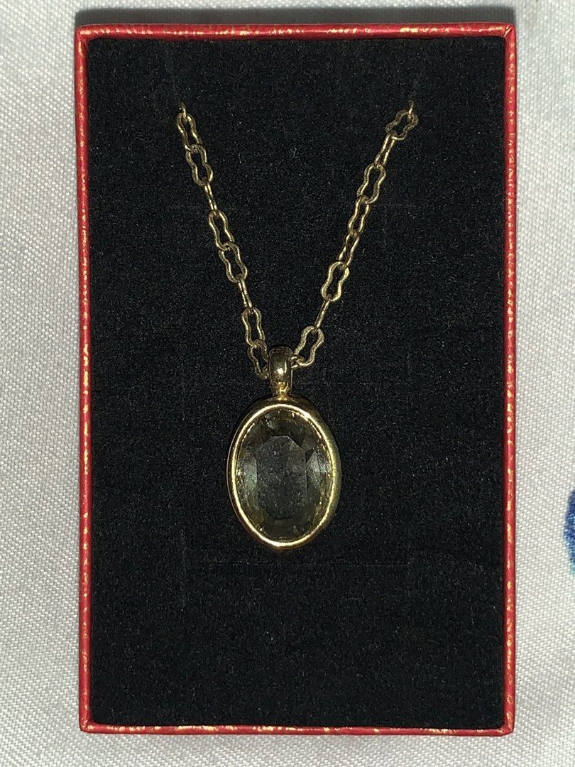 Gold Necklace with Oval Pendant (Category: Necklaces) located in Dasmarinas. Submitted by swiftstar_ce788c (Listing ID 1449396043, Image 2). Description: - Brand new gold necklace - Features a delicate chain - Oval-cut pendant with a light yellowish-green hue - Price: 150 - Box not included.
