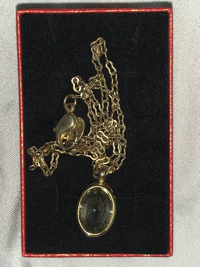Gold Necklace with Oval Pendant (Category: Necklaces) located in Dasmarinas. Submitted by swiftstar_ce788c (Listing ID 1449396043, Image 3). Description: - Brand new gold necklace - Features a delicate chain - Oval-cut pendant with a light yellowish-green hue - Price: 150 - Box not included.