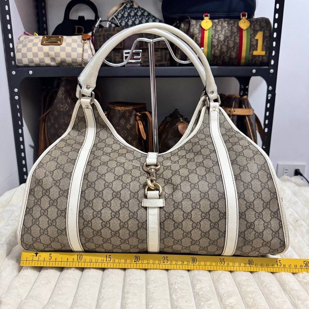 Gucci Beige/White GG Canvas Joy Medium Bag (Category: Luxury Bags & Wallets) located in Angeles City. Submitted by cherrypicked.ph (Listing ID 1449487853, Image 3). Description: Gucci Beige/White GG Canvas Joy Medium Bag Condition & Flaws: (See Detailed Pictures Attached) Made in Italy 📐 Measurements in CM Height: 32 cm Width: 45 cm Depth: 18 cm Drop: 28 cm Code: 203493 213317 📎 TAKE NOTE : • Please note that this is a used / thrifted piece, an