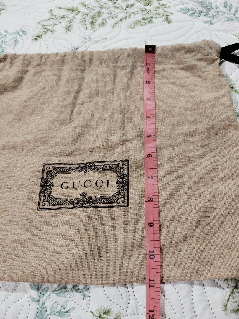 Gucci Dust Bag - Recycled Material (Category: Bags & Wallets) located in Kota Kinabalu. Submitted by riaqis87 (Listing ID 1449495501, Image 3). Description: - Authentic Gucci dust bag - Made from Global Recycled Standard certified material - Dimensions: Approx. 15 inches wide x 12 inches tall - Features a convenient drawstring closure - Ideal for safeguarding Gucci items or other accessories.