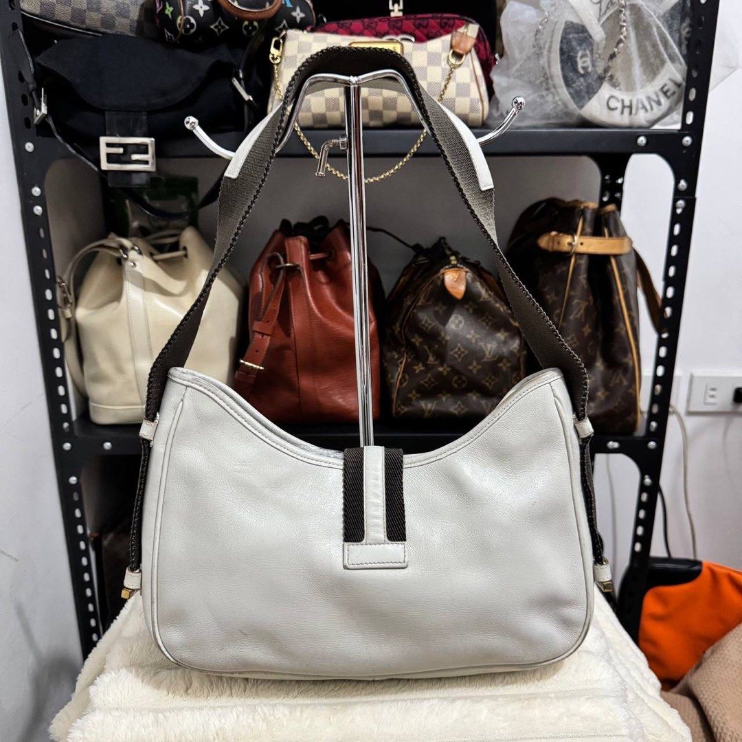 Gucci Jackie Canvas Leather Gray Shoulder Bag (Category: Luxury Bags & Wallets) located in Manila. Submitted by retro.archives (Listing ID 1449497987, Image 2). Description: Gucci Jackie Canvas Leather Gray Shoulder Bag Condition & Flaws: (See Detailed Pictures Attached) Made in Italy 📐 Measurements in CM Height: 18 cm Width: 27 cm Depth: 5.5 cm Drop: 25 cm Code: 92736 203998 📎 TAKE NOTE : • Please note that this is a used / thrifted piece, and