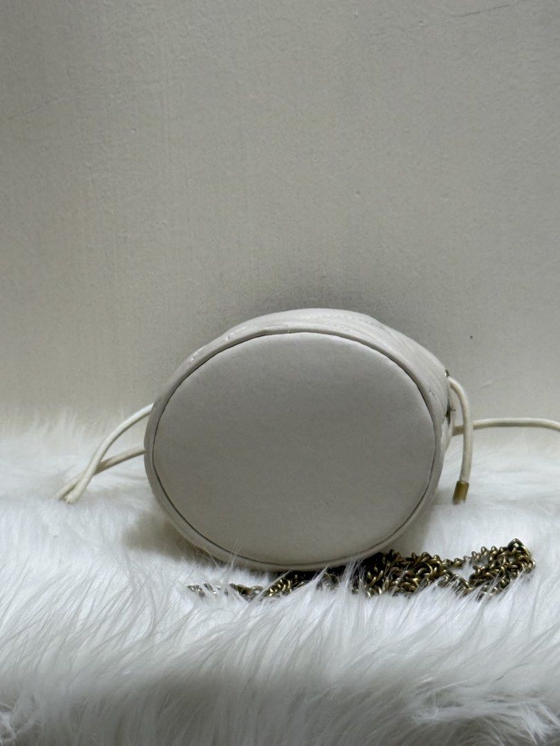 Mini Gucci GG Marmont Matelassé Bucket Bag (Off-White) (Category: Cross-body Bags) located in Quezon City. Submitted by clazzystudio (Listing ID 1447658799, Image 3). Description: Selling this chic Gucci GG Marmont Matelassé Bucket Bag in classic off-white quilted leather, featuring signature antique gold-tone Double G hardware and chain strap! ✨ Features & Details: Material: Matelassé chevron leather with antique gold-tone hardware Color: Off-Wh