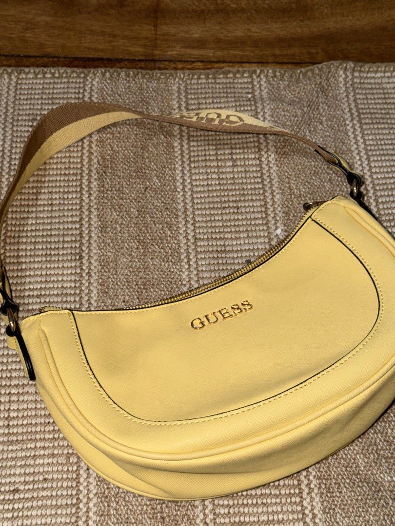 Guess Norwood Yellow Shoulder Bag (Bought in Japan) (Category: Shoulder Bags) located in Manila. Submitted by carolinesells (Listing ID 1449456878, Image 2). Description: Guess Norwood yellow shoulder bag -Cute yellow Guess shoulder bag - Guess logo on the strap - Interior zip pocket and slip pocket - Zipper closure - Great for everyday use - Shows some minor marks on the exterior (please check photos) As Is Where Is Basis - Bought in Japan Cash 