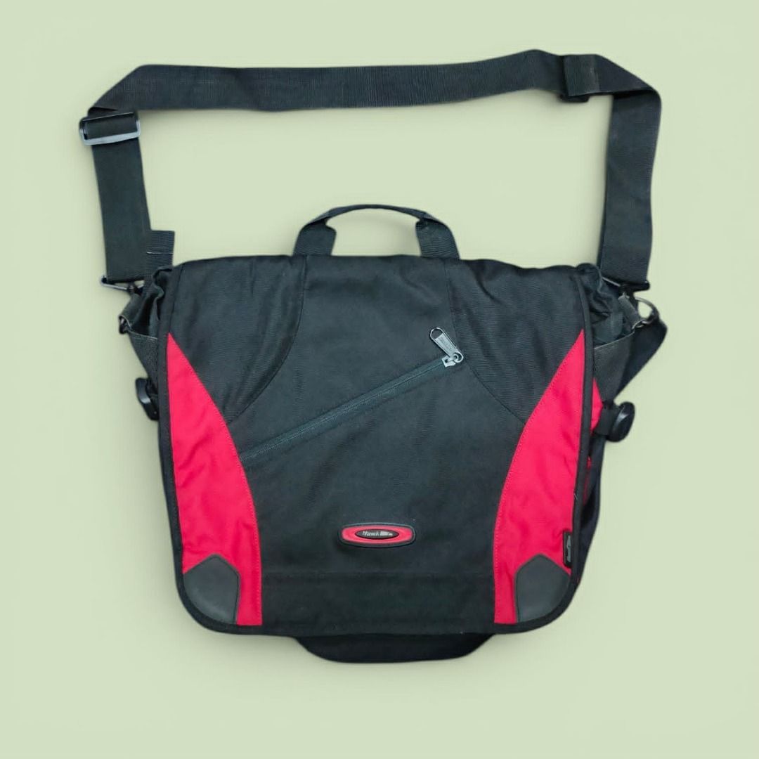 Hawk Messenger Bag (BRED) (Category: Sling Bags) located in Manila. Submitted by montillano25396 (Listing ID 1449488869, Image 1). Description: -Hawk Messenger Back Red and Black Combination - Size: Large Minimal issue: rust stain and minor fade - Still in Great Condition.