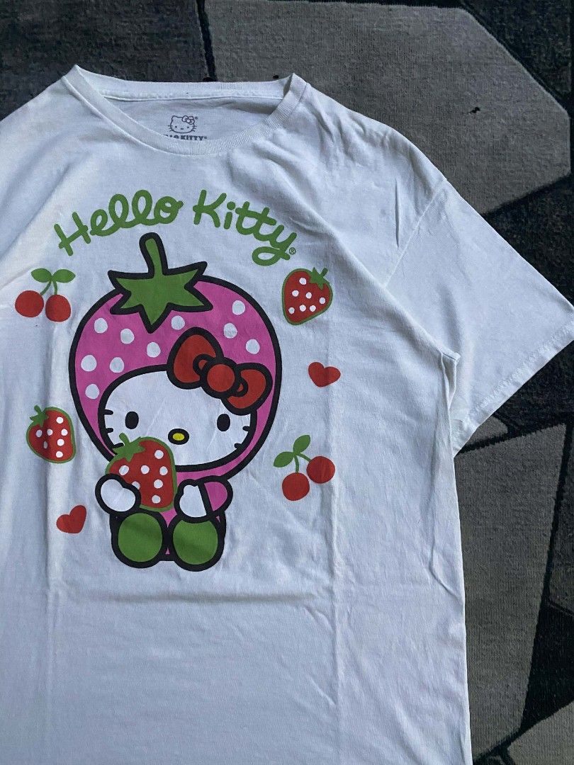 HELLO KITTY (Category: Shirts) located in Taguig. Submitted by _john.patrick (Listing ID 1449430912, Image 2). Description: HELLO KITTY (SANRIO UNDER LICENSE, 2023) LARGE ON TAG WIDTH 21 LENGTH 28 EXCELLENT CONDITION.