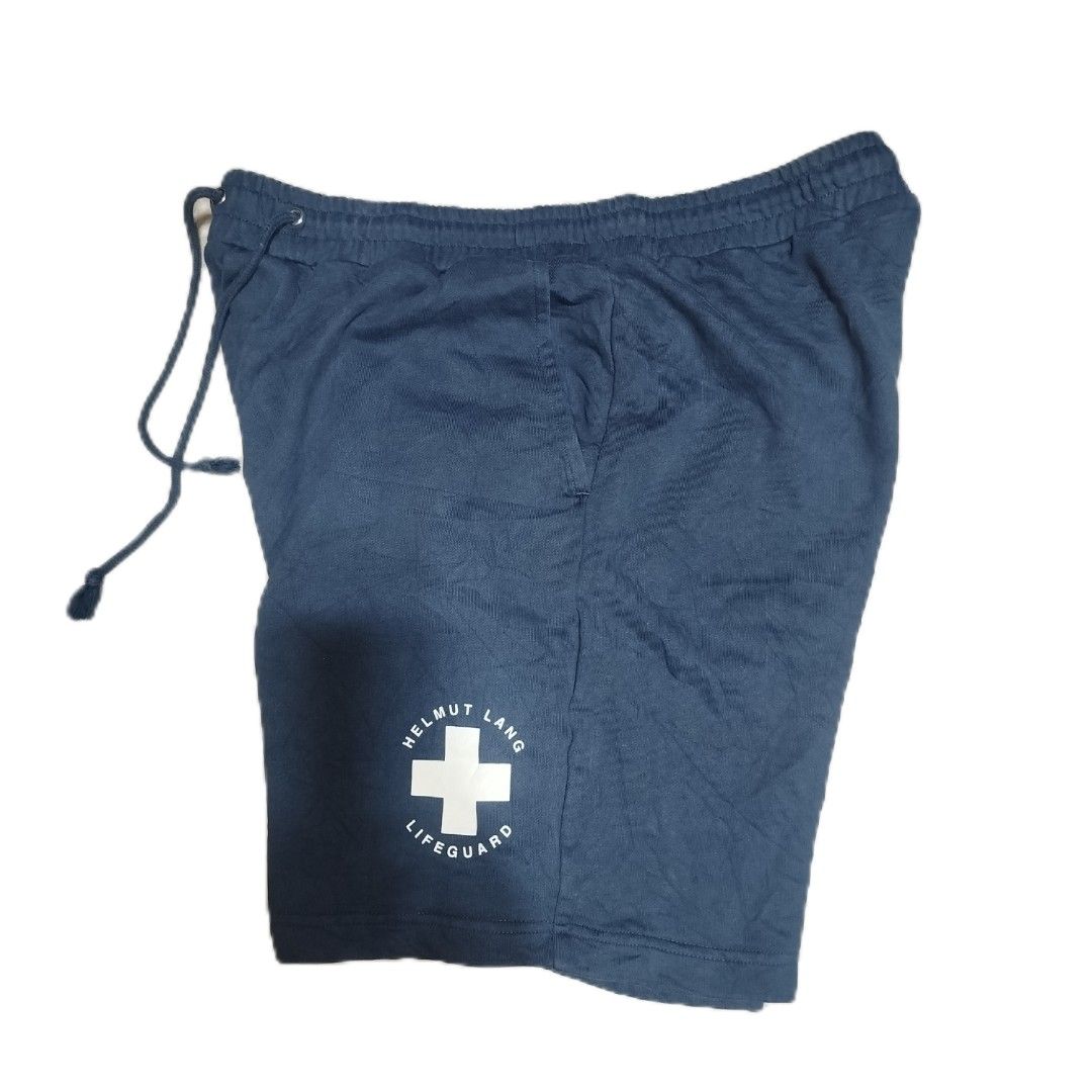 Helmut Lang Lifeguard Shorts Navy Blue (Category: Shorts) located in Davao. Submitted by vernoneighty4 (Listing ID 1449478297, Image 1). Description: - Navy blue Helmut Lang shorts - Features 'Lifeguard' graphic print on the leg - dimension W32-38 L21 - Elastic waistband with drawstring - Comfortable fit - Perfect for casual wear.