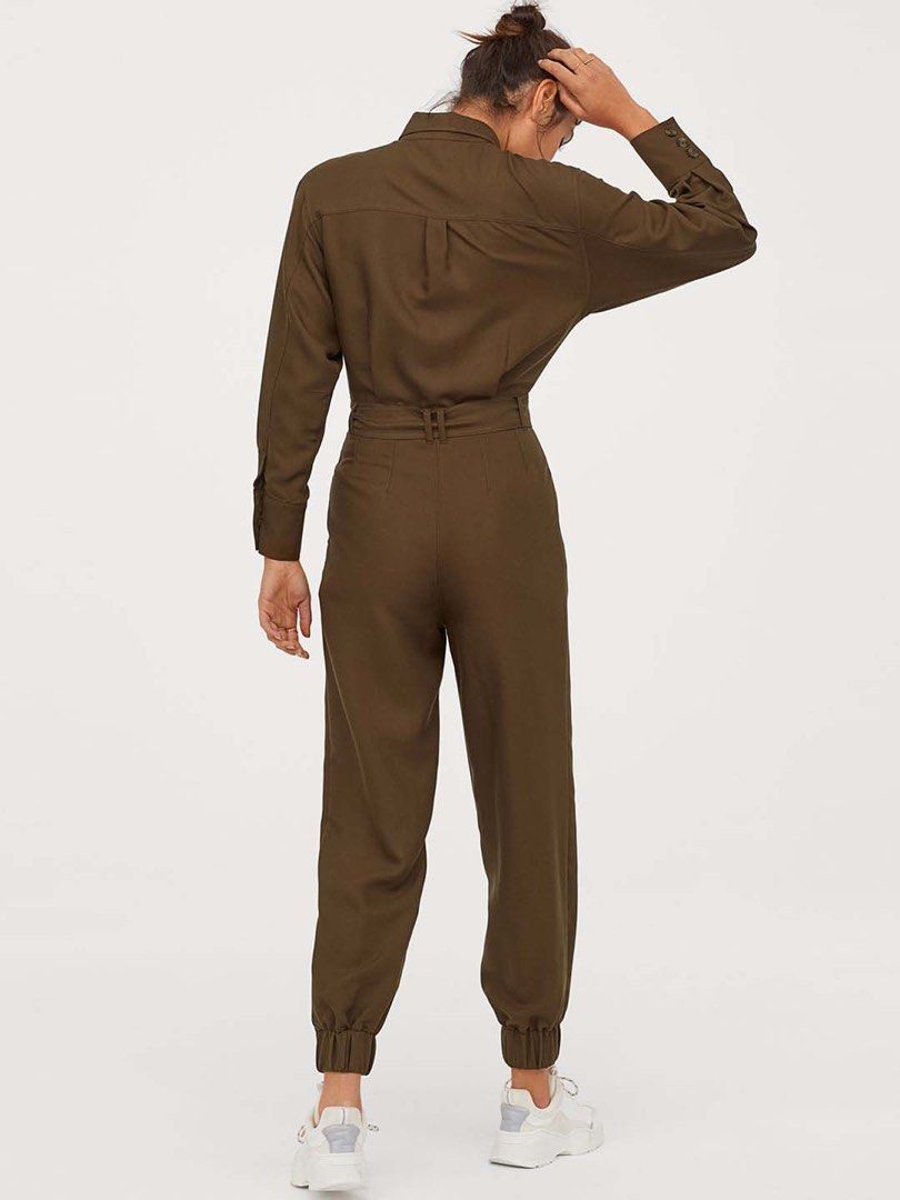 H&M Utility Belted Jumpsuit Olive Green (Category: Jumpsuits) located in Manila. Submitted by inationg (Listing ID 1449424175, Image 2). Description: - Olive green utility jumpsuit from H&M - Long sleeves with button cuffs - Button-up front with chest pockets - Includes a matching fabric belt - Jogger-style cuffs at the ankles - Ideal for casual outings.