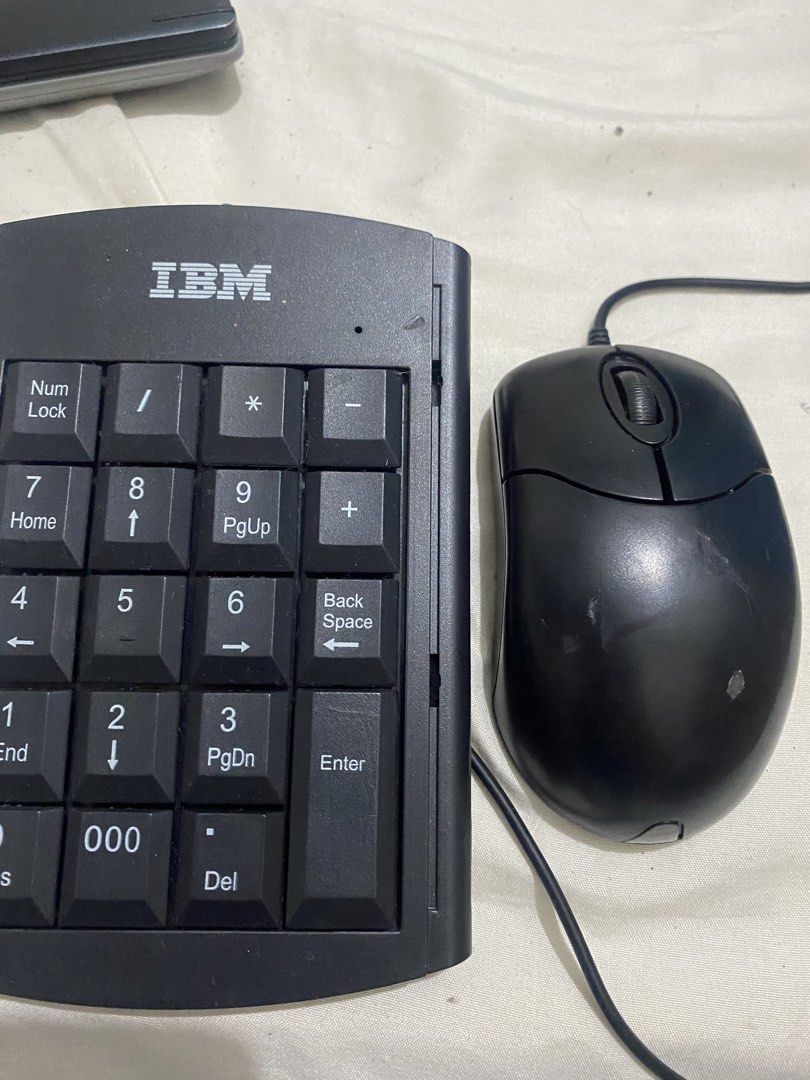 IBM Numeric Keypad and Mouse Combo (Category: Computer Keyboard) located in Manila. Submitted by newdolphin.4097cf (Listing ID 1449481960, Image 2). Description: - IBM wired numeric keypad with full number keys (Num Lock, Enter, Del) - Standard wired black mouse with 2 buttons and scroll wheel - Ideal for data entry or adding extra number keys - Both items tested and confirmed working.