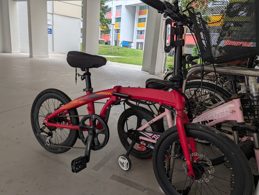 JAVA Folding Bicycle Red (Category: Bicycles) located in Singapore. Submitted by holloww (Listing ID 1449533436, Image 2). Description: - Red JAVA folding bike - 20-inch wheels - Front and rear disc brakes - Comes with a basket - Ideal for commuting and casual rides - Ready for a new owner - Condition as what you see.